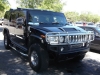 A black Hummer...gutsy and shiny....prefer this to a Cadillac any day!